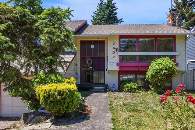 7407 25th Ave NE, Seattle, WA 98115 - view of front of house with a chimney and a shingled roof