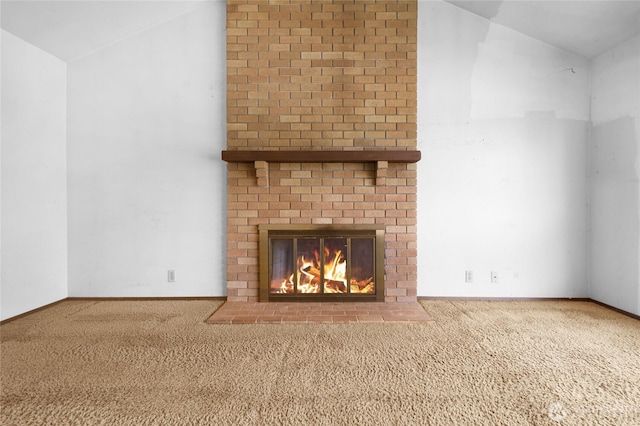 7407 25th Ave NE, Seattle, WA 98115 - unfurnished living room with carpet floors, vaulted ceiling, a fireplace, and baseboards