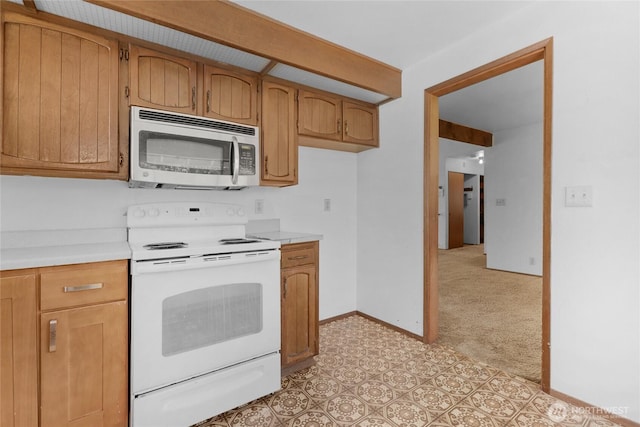 7407 25th Ave NE, Seattle, WA 98115 - kitchen featuring stainless steel microwave, electric stove, light countertops, and baseboards