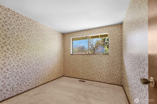 7407 25th Ave NE, Seattle, WA 98115 - carpeted empty room with wallpapered walls