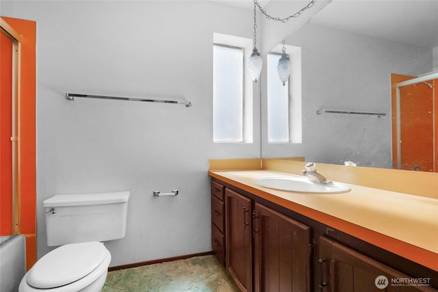 7407 25th Ave NE, Seattle, WA 98115 - full bathroom featuring vanity, toilet, baseboards, and shower / bath combination with glass door