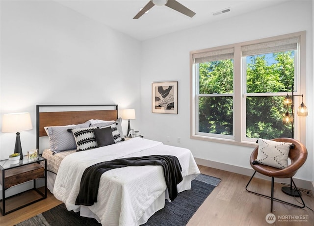 2222 E Mcgraw St, Seattle, WA 98112 - bedroom featuring wood finished floors, ceiling fan, and baseboards