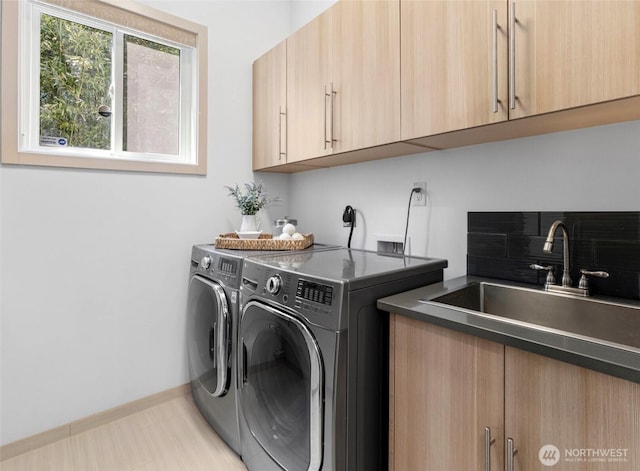 2222 E Mcgraw St, Seattle, WA 98112 - laundry area with separate washer and dryer, cabinet space, and baseboards