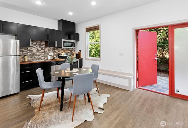 2222 E Mcgraw St, Seattle, WA 98112 - dining room featuring light wood finished floors and recessed lighting