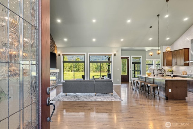 1550 Old Cedars Rd, Cle Elum, WA 98922 - living room with wood finished floors, high vaulted ceiling, recessed lighting, baseboards, and a fireplace