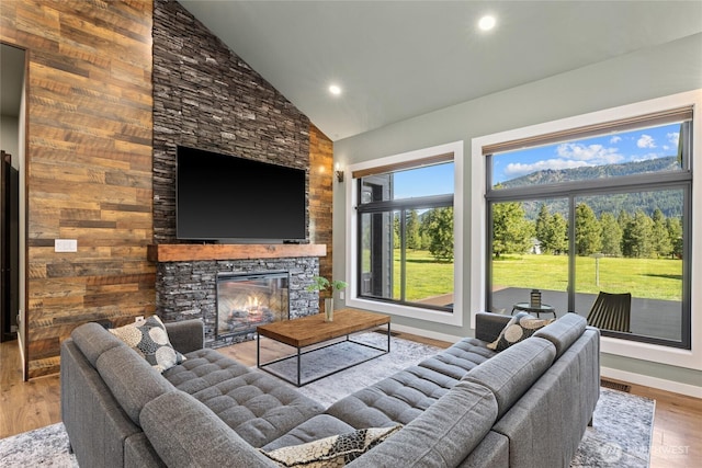 1550 Old Cedars Rd, Cle Elum, WA 98922 - living room with high vaulted ceiling, a fireplace, wood finished floors, baseboards, and recessed lighting