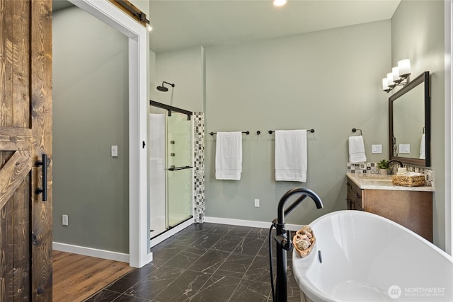 1550 Old Cedars Rd, Cle Elum, WA 98922 - bathroom with vanity, baseboards, a stall shower, a freestanding tub, and recessed lighting