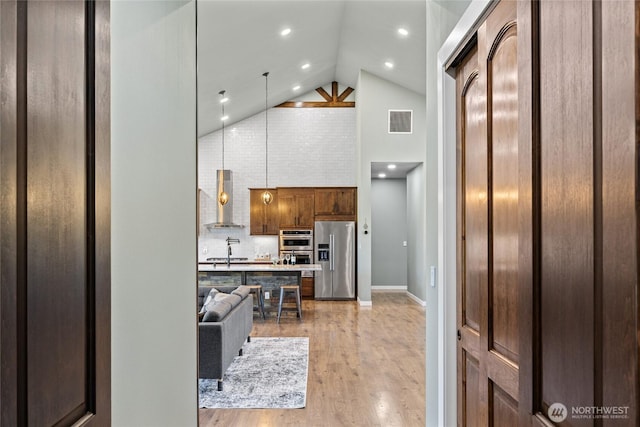 1550 Old Cedars Rd, Cle Elum, WA 98922 - living area featuring high vaulted ceiling, light wood-style floors, baseboards, and recessed lighting