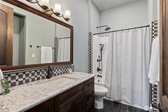 1550 Old Cedars Rd, Cle Elum, WA 98922 - bathroom with vanity, toilet, marble finish floors, shower / bath combo, and tasteful backsplash