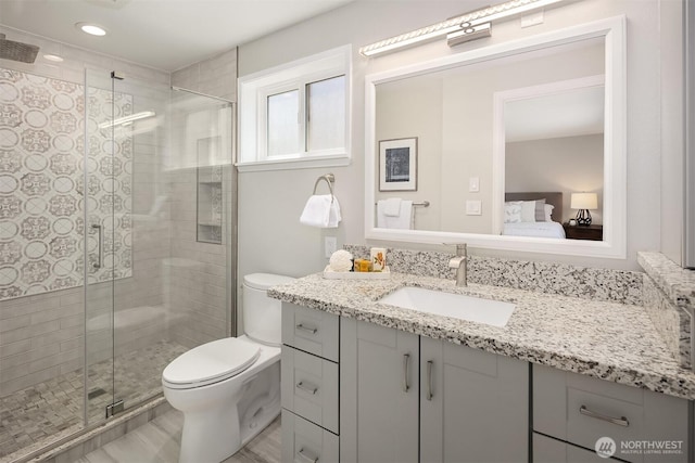 10808 158th Ct NE, Redmond, WA 98052 - bathroom with vanity, toilet, a stall shower, ensuite bath, and recessed lighting
