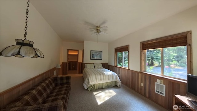 321 N Lake Surf Dr, Lilliwaup, WA 98555 - bedroom featuring wainscoting, wood walls, carpet floors, and ceiling fan