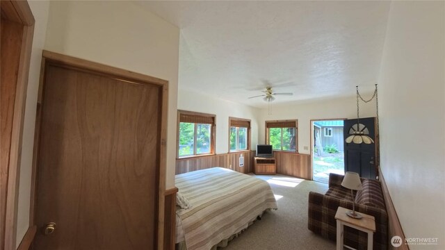 321 N Lake Surf Dr, Lilliwaup, WA 98555 - carpeted bedroom featuring access to outside and ceiling fan