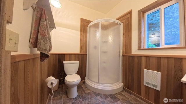 321 N Lake Surf Dr, Lilliwaup, WA 98555 - bathroom with a shower stall, a wainscoted wall, wooden walls, and stone finish floors