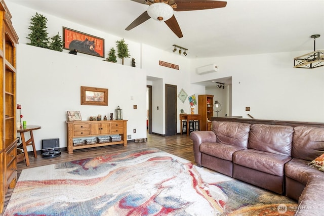 114 Black Bear Ln, Centralia, WA 98531 - living room with a ceiling fan, a wall mounted air conditioner, wood finished floors, and lofted ceiling