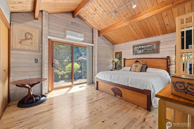 606 E Pointes Dr W, Shelton, WA 98584 - bedroom with wooden walls, rail lighting, a wall unit AC, wood-type flooring, and access to outside