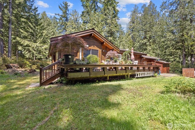 606 E Pointes Dr W, Shelton, WA 98584 - rear view of property with a yard and a wooden deck
