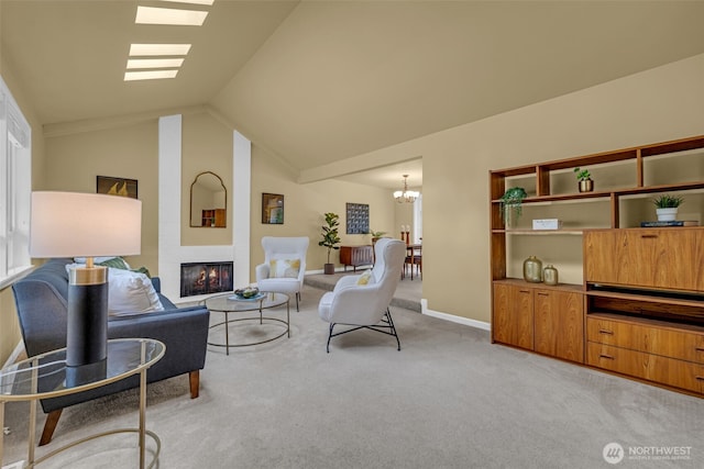17620 NE 29th St, Redmond, WA 98052 - living area with light carpet, a chandelier, a large fireplace, vaulted ceiling, and baseboards