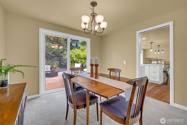 17620 NE 29th St, Redmond, WA 98052 - dining space featuring a chandelier, light colored carpet, and baseboards