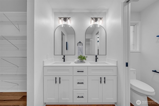 17620 NE 29th St, Redmond, WA 98052 - full bath featuring double vanity, toilet, wood finished floors, and a spacious closet