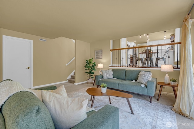 17620 NE 29th St, Redmond, WA 98052 - living room with carpet floors, baseboards, and stairs