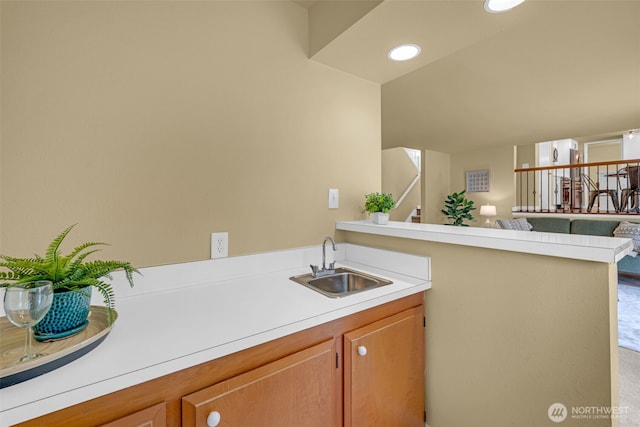 17620 NE 29th St, Redmond, WA 98052 - kitchen with a sink, light countertops, a peninsula, and open floor plan