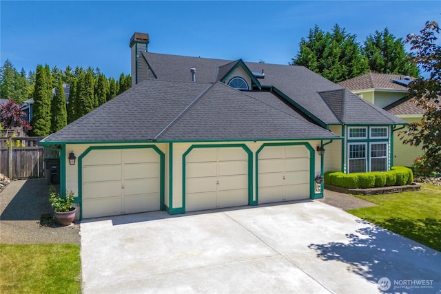 27742 214th Ave SE, Maple Valley, WA 98038 - view of front of home with a garage, driveway, a chimney, and roof with shingles