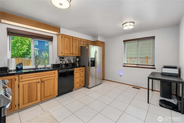 27742 214th Ave SE, Maple Valley, WA 98038 - kitchen featuring dishwasher, stainless steel fridge, a sink, stove, and brown cabinets