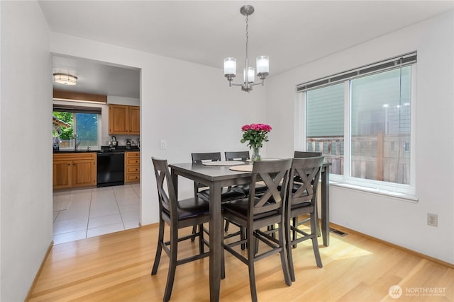 27742 214th Ave SE, Maple Valley, WA 98038 - dining room featuring a chandelier and light wood-style floors