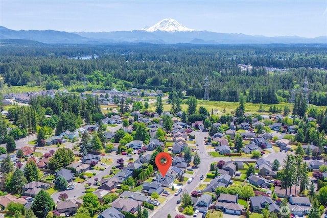 27742 214th Ave SE, Maple Valley, WA 98038 - aerial perspective of suburban area featuring a forest and a mountainous background