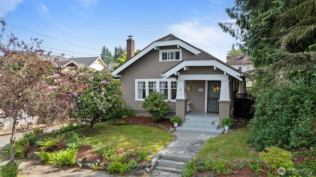 2902 N 22nd, Tacoma, WA 98406 - view of front of property featuring a chimney, a front lawn, and a porch