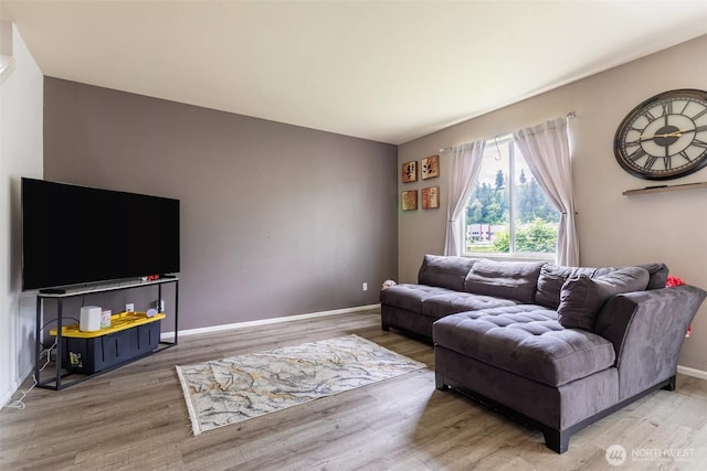 570 Beaver Blvd Unit A, Pacific, WA 98047 - living area featuring wood finished floors and baseboards