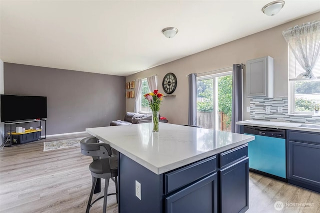 570 Beaver Blvd Unit A, Pacific, WA 98047 - kitchen featuring dishwasher, open floor plan, light wood finished floors, and light countertops