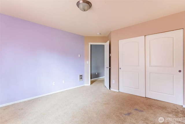 570 Beaver Blvd Unit A, Pacific, WA 98047 - unfurnished bedroom featuring carpet floors, baseboards, and a closet