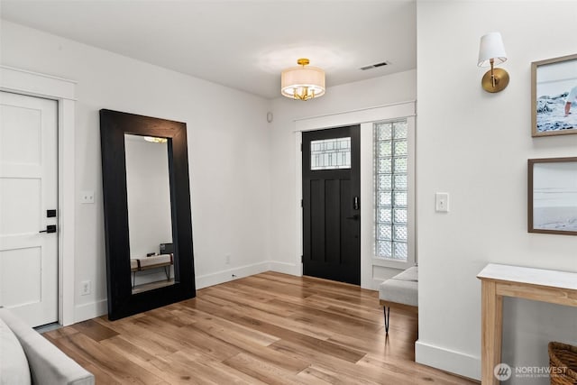 9814 36th St E, Edgewood, WA 98371 - foyer with light wood-style flooring and baseboards