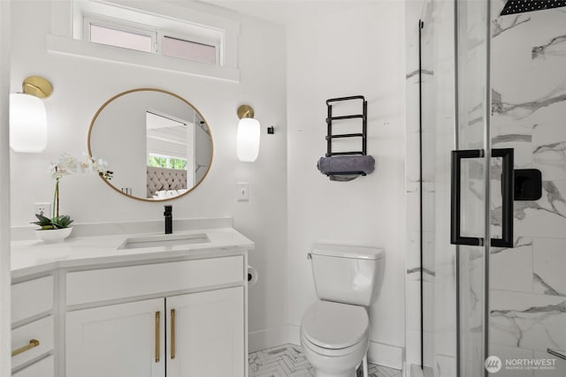 9814 36th St E, Edgewood, WA 98371 - bathroom featuring a marble finish shower, vanity, baseboards, and toilet