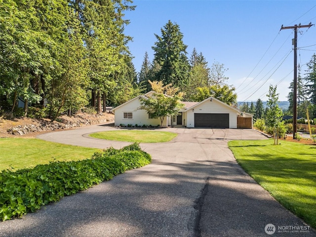 9814 36th St E, Edgewood, WA 98371 - ranch-style home featuring an attached garage, asphalt driveway, and a front lawn
