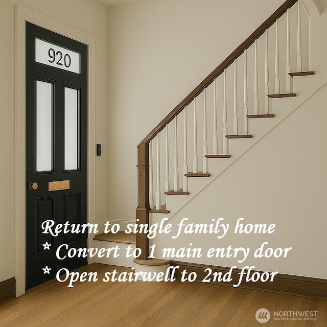 920 4th Ave N, Seattle, WA 98109 - foyer featuring stairs, baseboards, and wood finished floors