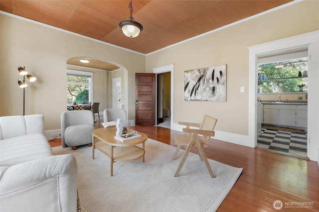 920 4th Ave N, Seattle, WA 98109 - living room with arched walkways, ornamental molding, wood finished floors, and baseboards
