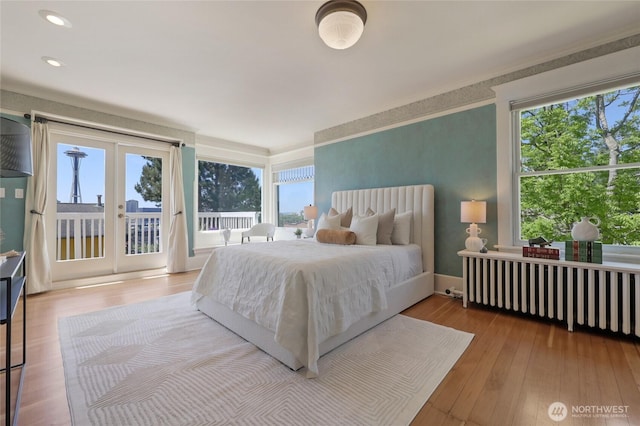 920 4th Ave N, Seattle, WA 98109 - bedroom with access to outside, multiple windows, french doors, hardwood / wood-style flooring, and recessed lighting