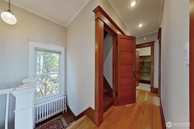 920 4th Ave N, Seattle, WA 98109 - corridor featuring radiator, ornamental molding, light wood finished floors, recessed lighting, and wainscoting