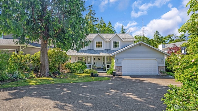 25161 13th Ave S, Des Moines, WA 98198 - view of front of property featuring concrete driveway, a porch, and a garage