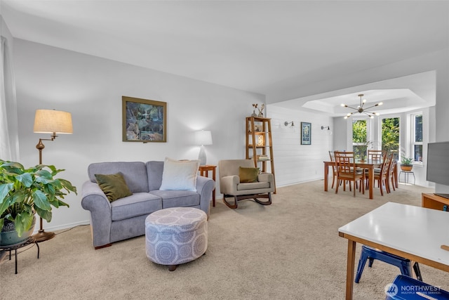25161 13th Ave S, Des Moines, WA 98198 - carpeted living area featuring a chandelier, baseboards, and a tray ceiling