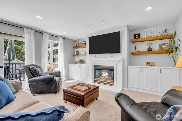 25161 13th Ave S, Des Moines, WA 98198 - living room featuring light colored carpet, recessed lighting, a fireplace, and baseboards