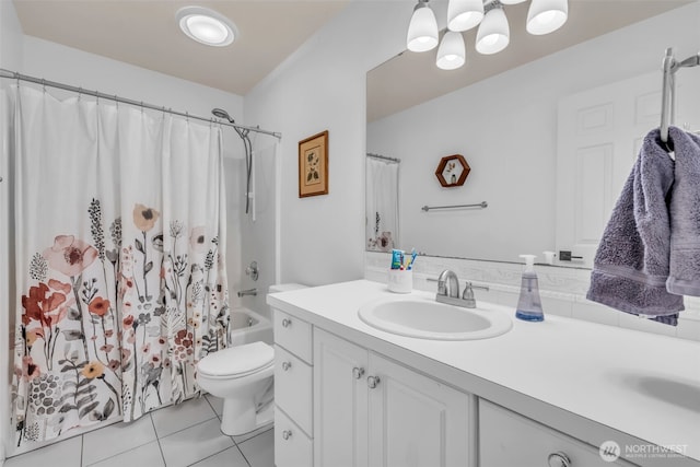 25161 13th Ave S, Des Moines, WA 98198 - bathroom featuring vanity, toilet, tile patterned flooring, and shower / bath combo with shower curtain