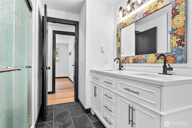 1668 Sapphire Trl, Bellingham, WA 98226 - bathroom featuring double vanity and a shower with door