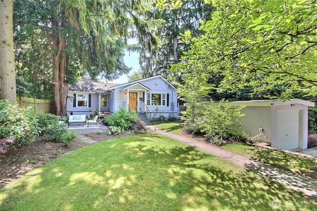 719 N 92nd St, Seattle, WA 98103 - view of front facade with a garage and an outdoor structure