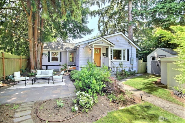 719 N 92nd St, Seattle, WA 98103 - view of front facade featuring outdoor lounge area and a patio