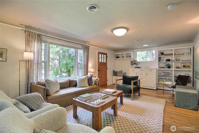 719 N 92nd St, Seattle, WA 98103 - living room with light wood finished floors and crown molding