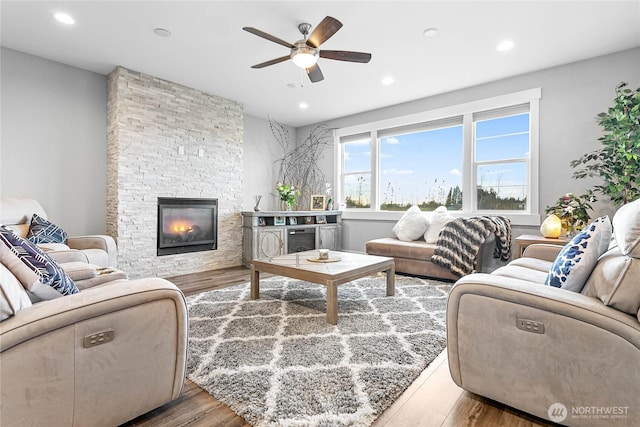 6041 Brian Ct, Ferndale, WA 98248 - living room with a ceiling fan, wood finished floors, a stone fireplace, and recessed lighting