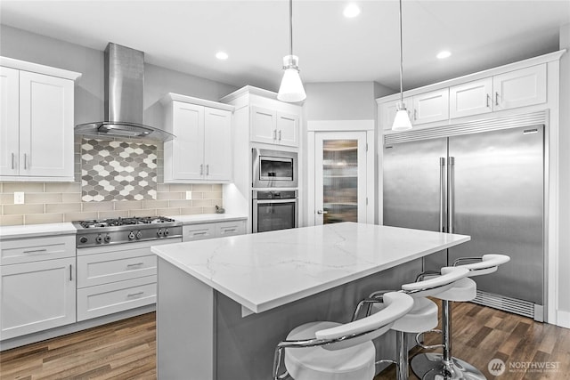 6041 Brian Ct, Ferndale, WA 98248 - kitchen featuring built in appliances, wall chimney range hood, a center island, dark wood-style flooring, and recessed lighting